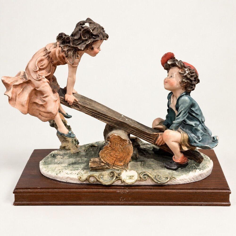 {Giuseppe Armani} Vintage boy and girl on a seesaw figurine